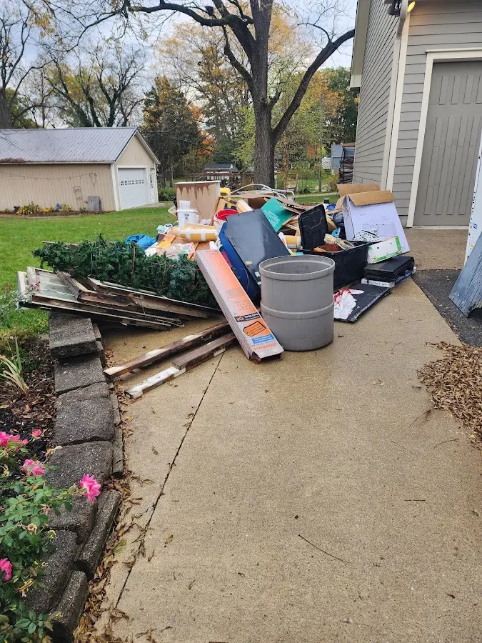 Dumpster being loaded with debris for Residential Dumpster Rental in Erie